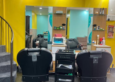 Bright salon interior at Lubys, Chennai, Tamil Nadu, IN with modern chairs and mirrors for a perfect beauty visit.