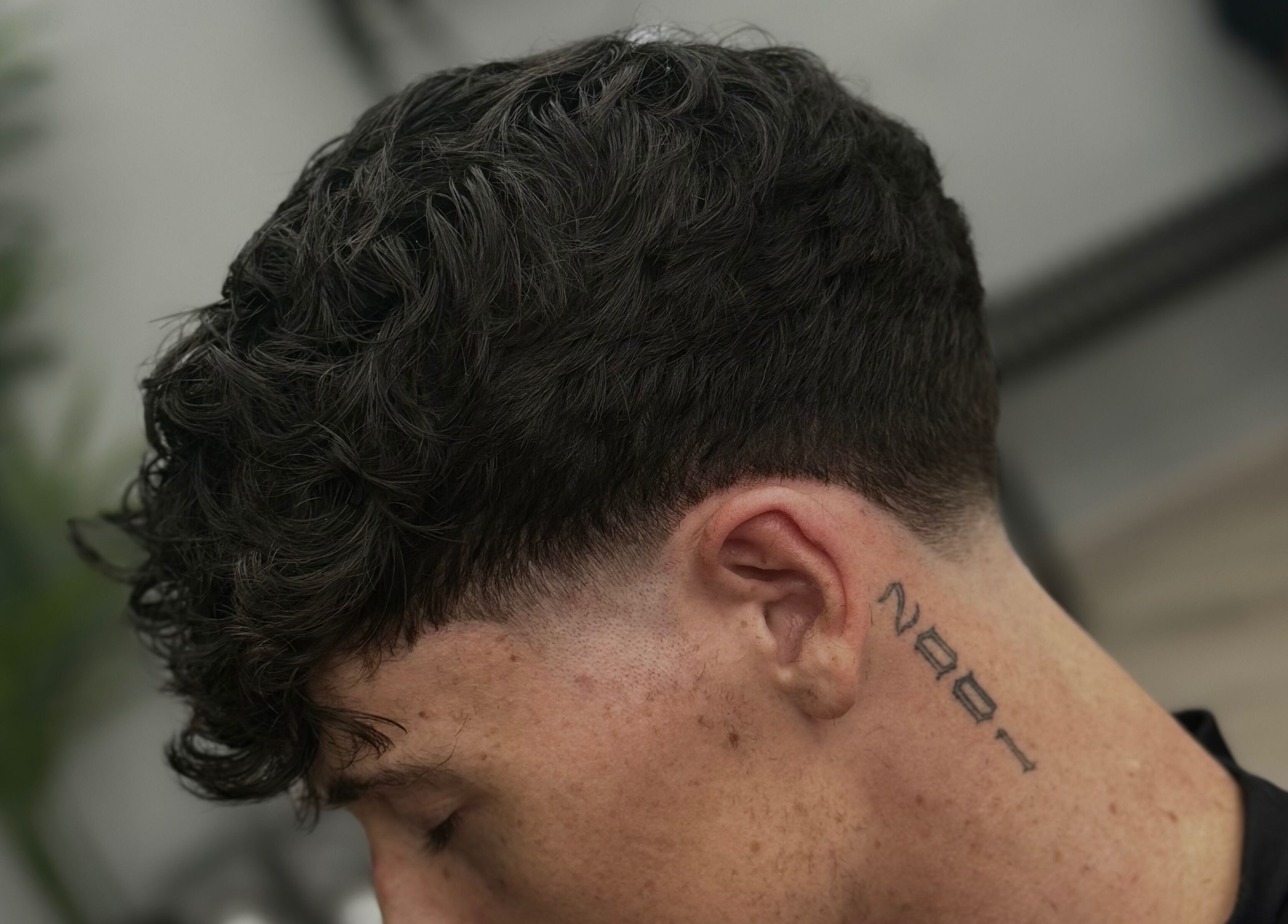 Close-up of a modern fade haircut at ODCUTZ, Portlaoise, County Laois, IE, illustrating expert styling.