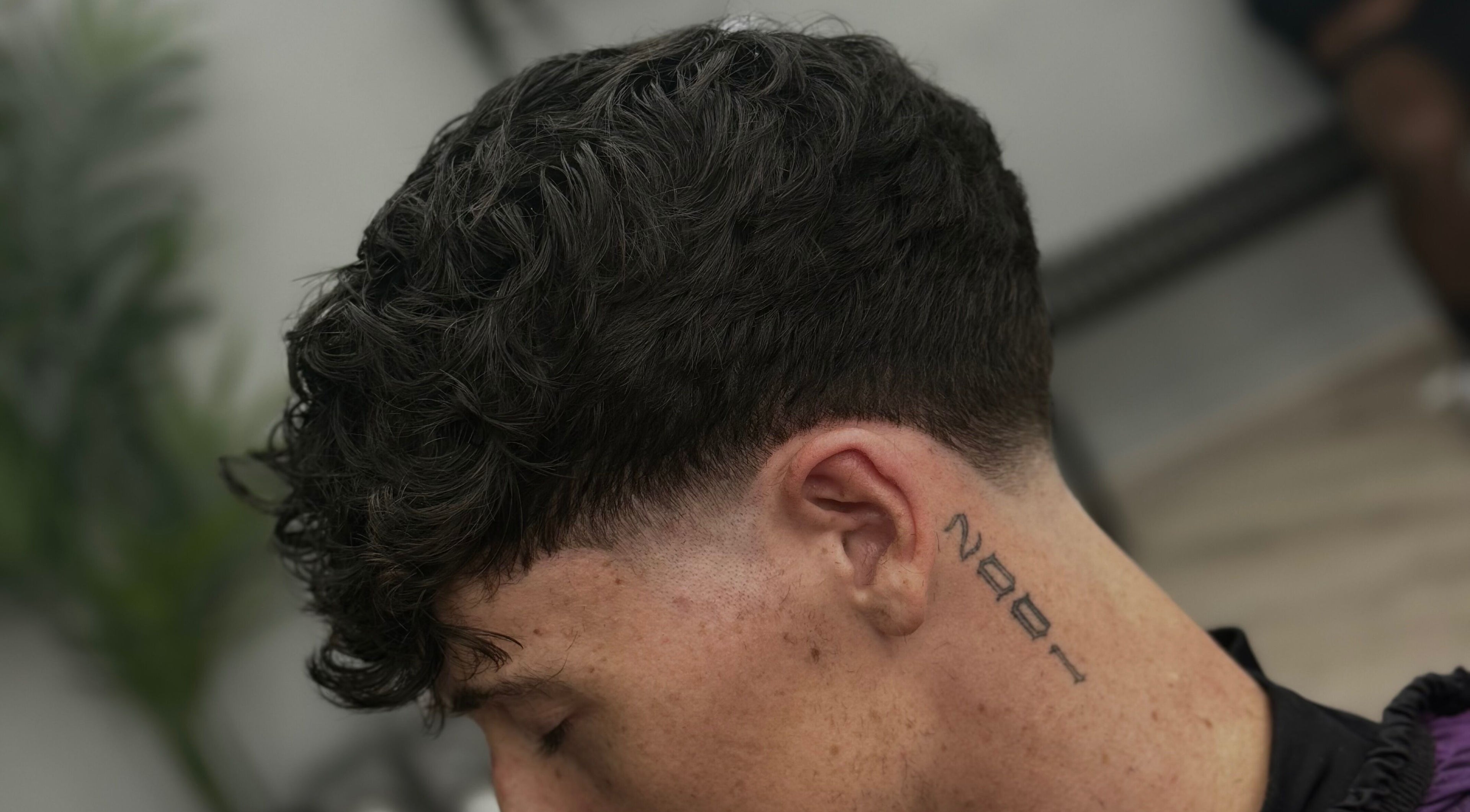 Close-up of a modern fade haircut at ODCUTZ, Portlaoise, County Laois, IE, illustrating expert styling.