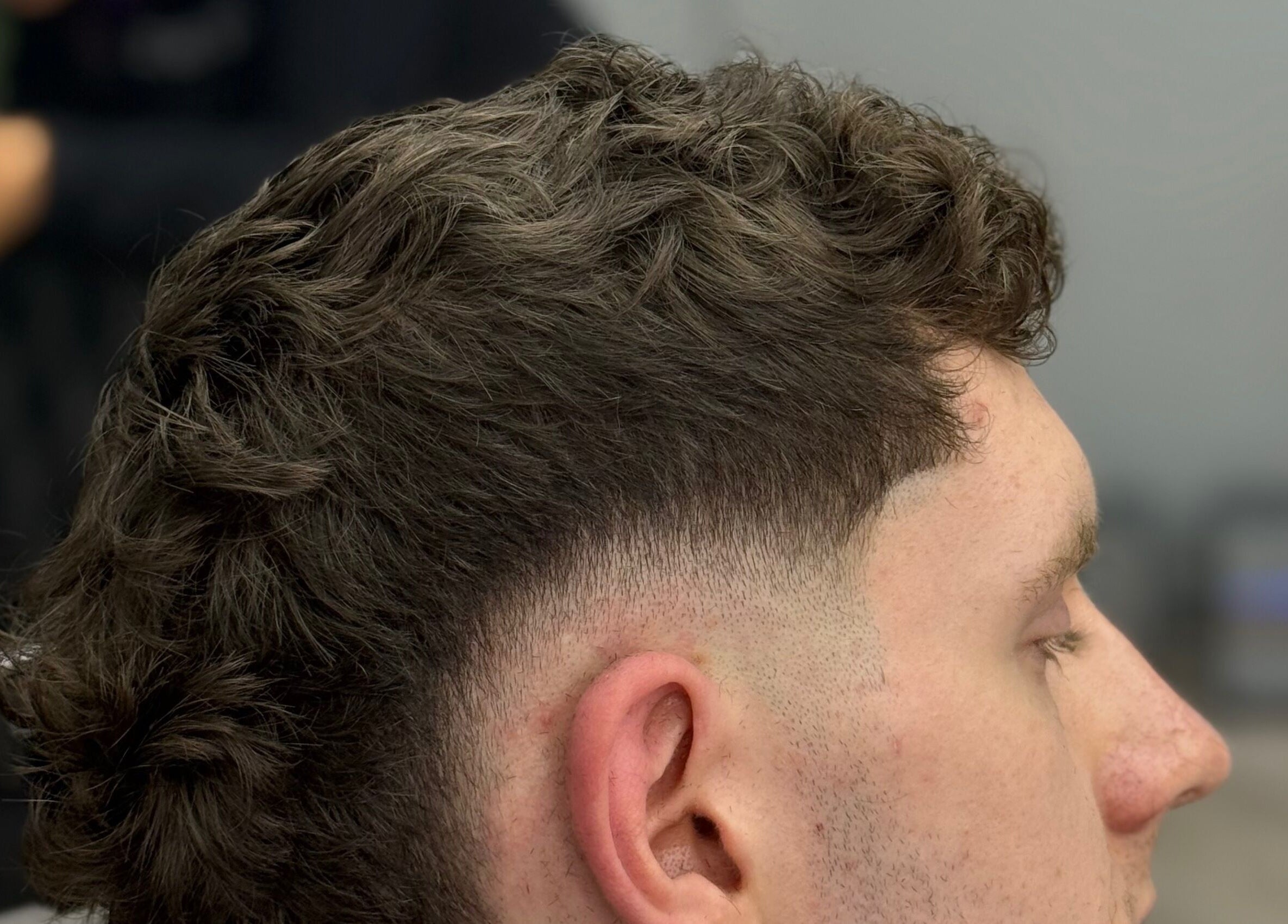 Close-up of a trendy fade haircut by ODCUTZ in Portlaoise, County Laois, IE. Professional male grooming showcased.