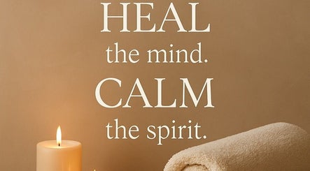 Massage 4 All in Brighton And Hove, England offers tranquility with candles and a rolled towel.
