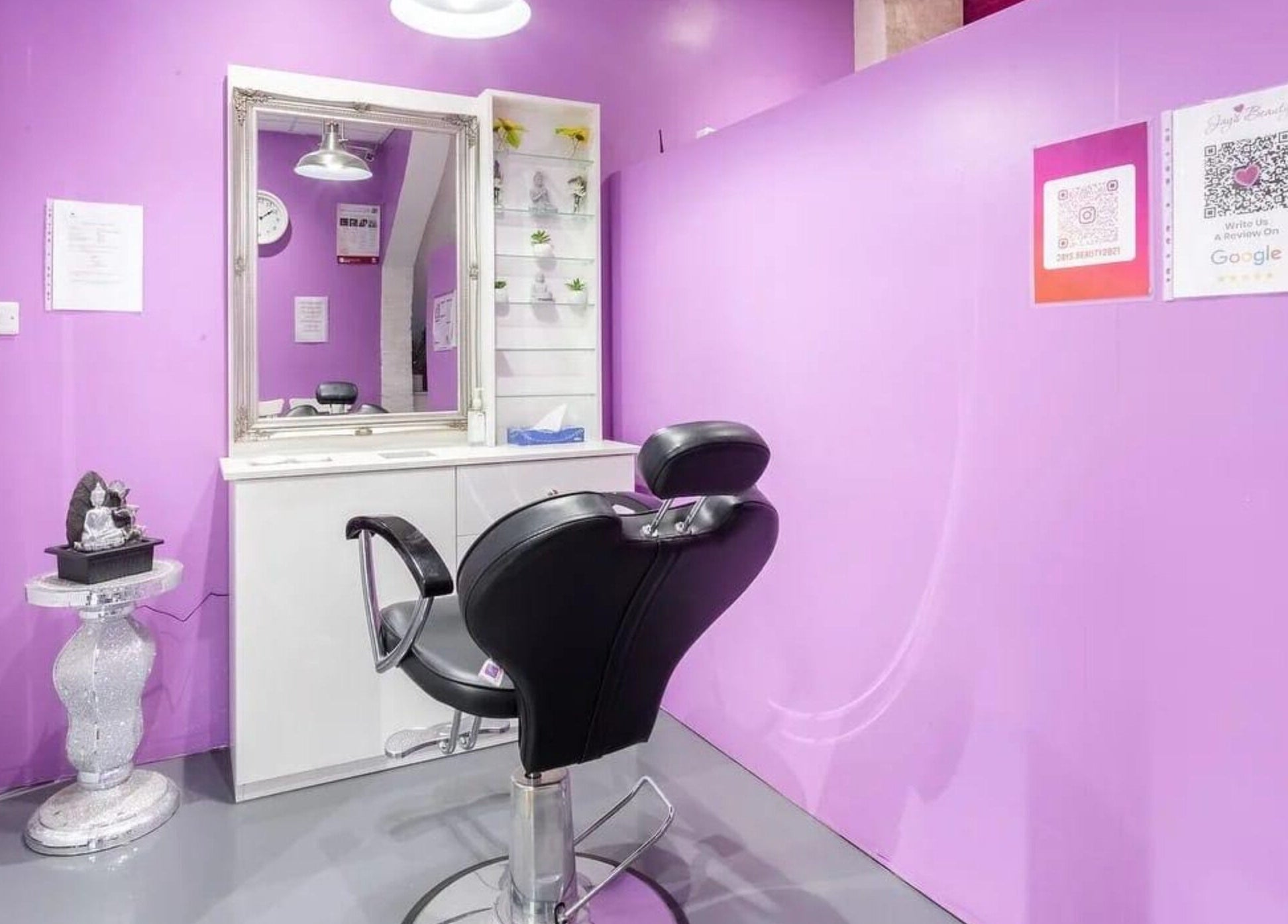 Elegant salon setup at Jay’s Beauty - Ladies Only in Hounslow, England, GB with purple walls and modern styling chair.