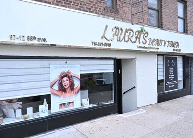 Front view of Laura's Beauty Touch in Rego Park, NY, highlighting vibrant storefront and signage.