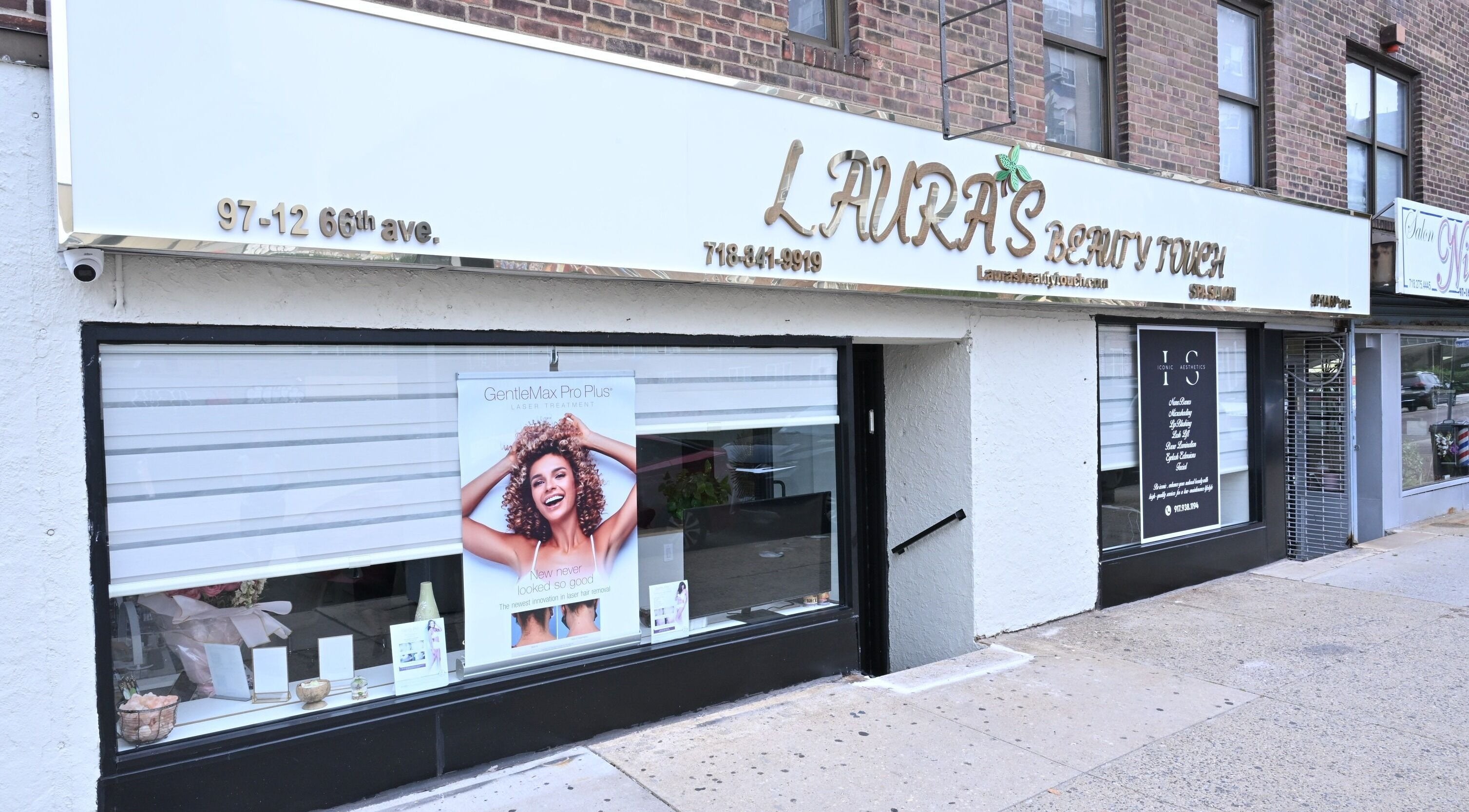 Front view of Laura's Beauty Touch in Rego Park, NY, highlighting vibrant storefront and signage.