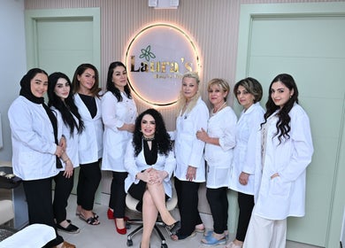 Laura's Beauty Touch team posing in Rego Park, NY, US, inside the welcoming salon environment.