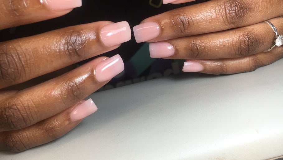 Elegant manicure at Dee’s Nail Diaries, Ga-rankuwa, Gauteng, ZA, showcasing glossy pink nails.