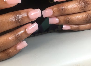 Elegant manicure at Dee’s Nail Diaries, Ga-rankuwa, Gauteng, ZA, showcasing glossy pink nails.