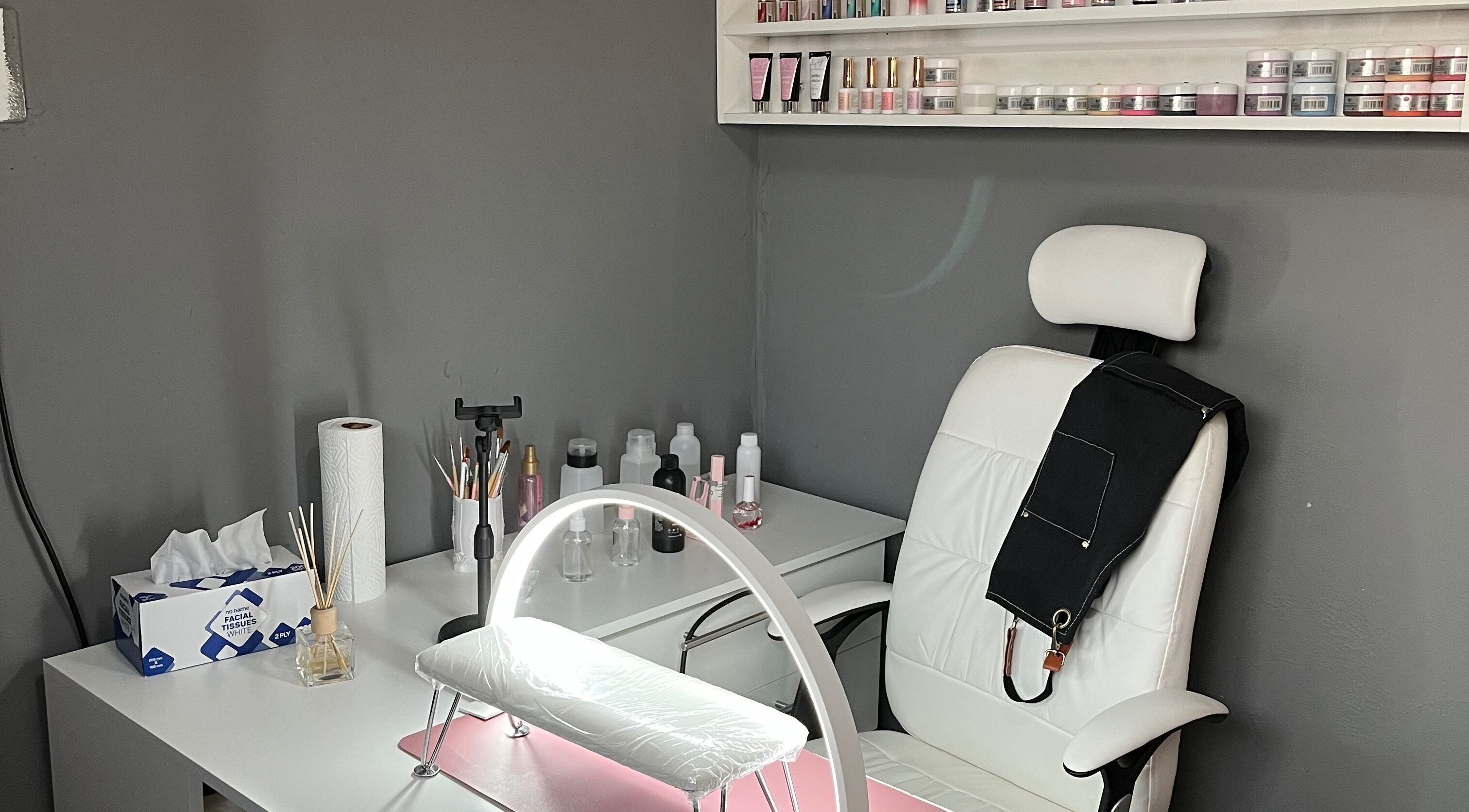 Nail station setup at House of Diidi, Ga-rankuwa, Gauteng, ZA, featuring manicure tools and comfy chair.