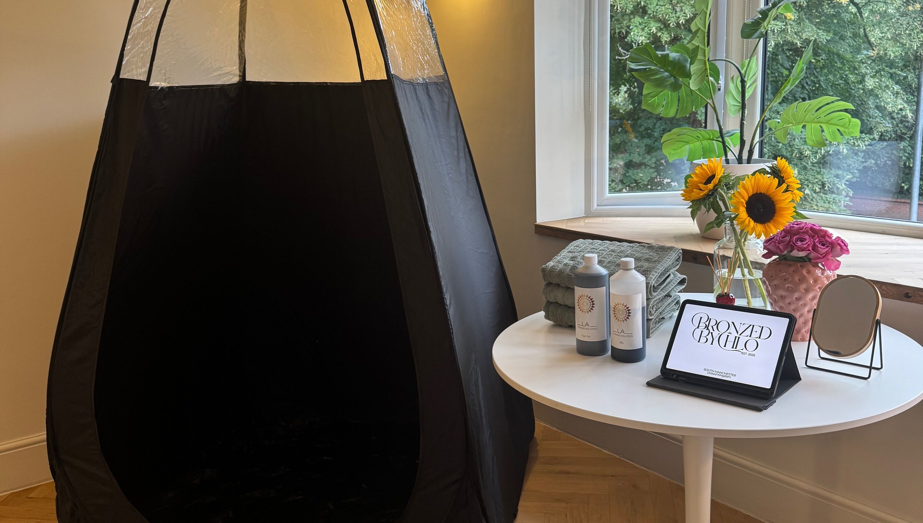 Tanning booth and products at Bronzed by Chlo, Manchester, England, GB.