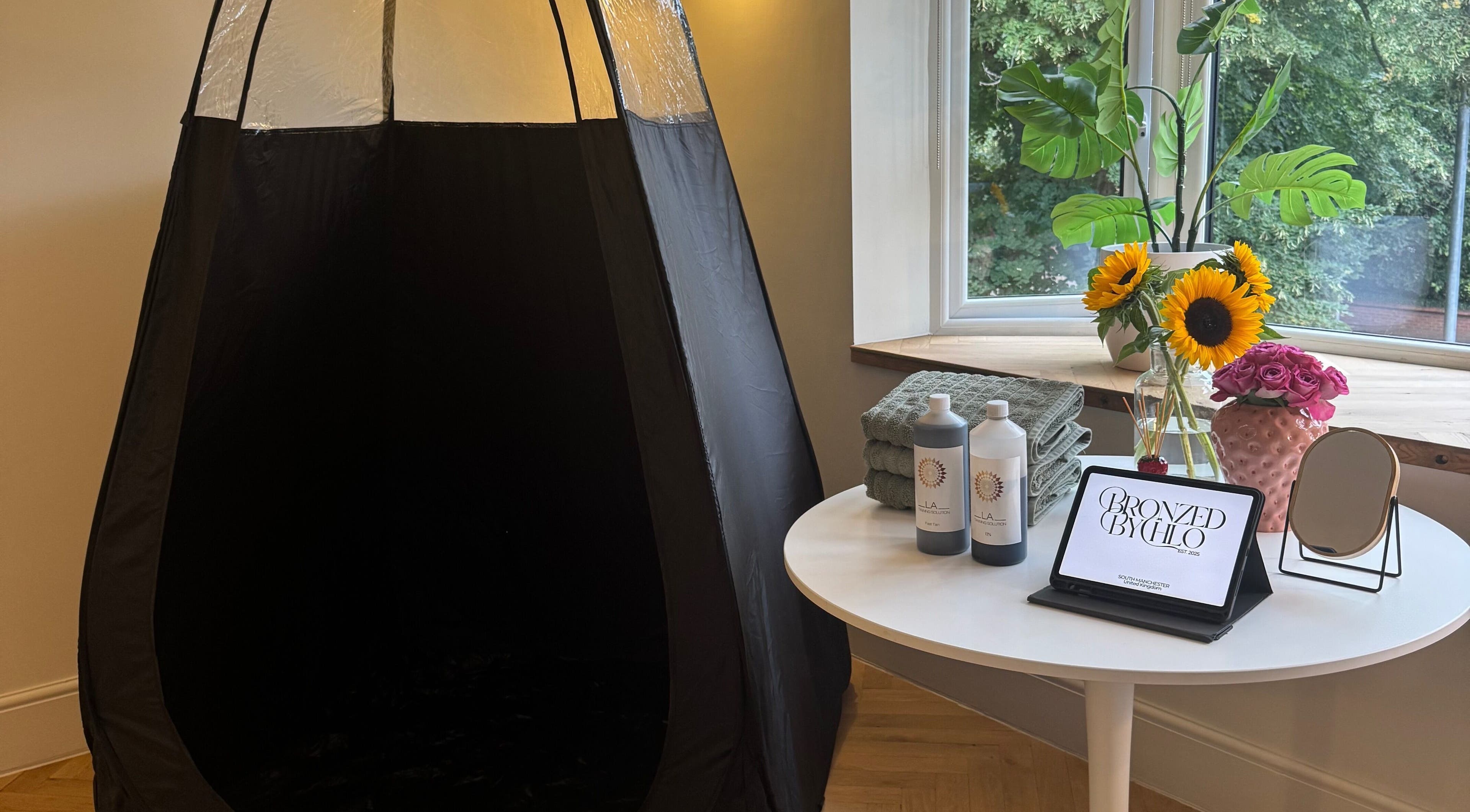 Tanning booth and products at Bronzed by Chlo, Manchester, England, GB.