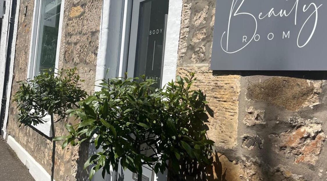 Entrance of Radiance beauty venue with a stone facade in Aberdour, Scotland, GB.