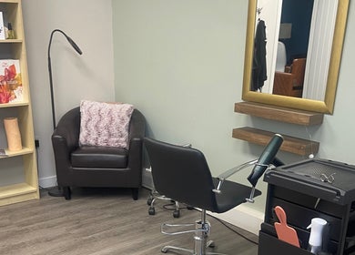 Comfortable salon chair and mirror at Niki Haair, Perth, Scotland, GB.