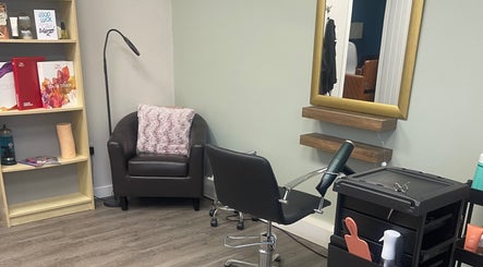 Comfortable salon chair and mirror at Niki Haair, Perth, Scotland, GB.
