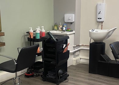 Modern salon chair and washing station at Niki Haair in Perth, Scotland, GB.