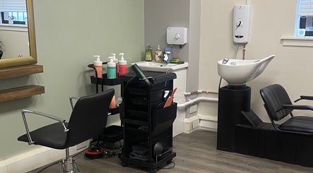 Modern salon chair and washing station at Niki Haair in Perth, Scotland, GB.