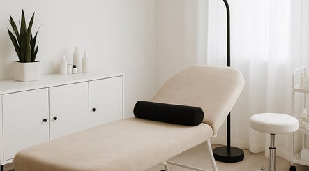Relaxing treatment room at Beat by clo, Burntwood, England, GB, featuring a cozy massage table and soothing decor.