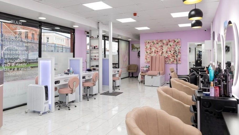 Indulgence Beauty and Hair Salon interior in Salford, England, GB with elegant decor and modern styling stations.