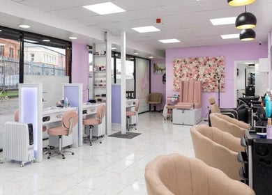 Indulgence Beauty and Hair Salon interior in Salford, England, GB with elegant decor and modern styling stations.