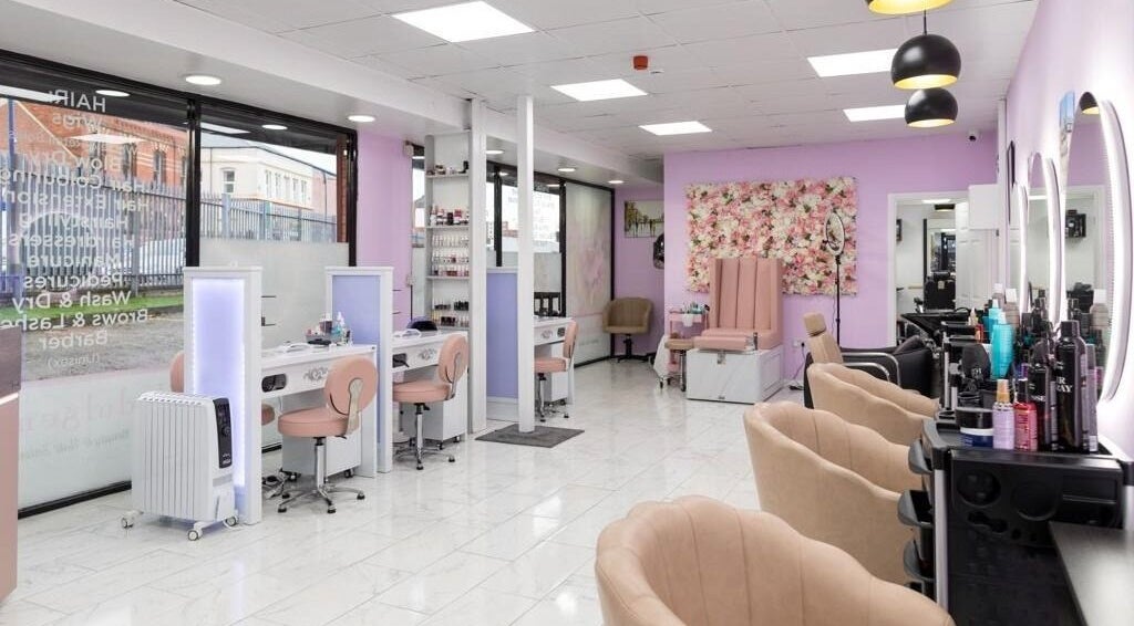 Indulgence Beauty and Hair Salon interior in Salford, England, GB with elegant decor and modern styling stations.