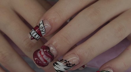 Intricate nail art design at Micah N Manis, Montréal, Québec, CA, featuring bold patterns and vibrant colors.
