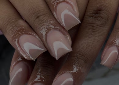 Close-up of manicured nails at Micah N Manis in Montréal, Québec, CA, showing glossy perfection.