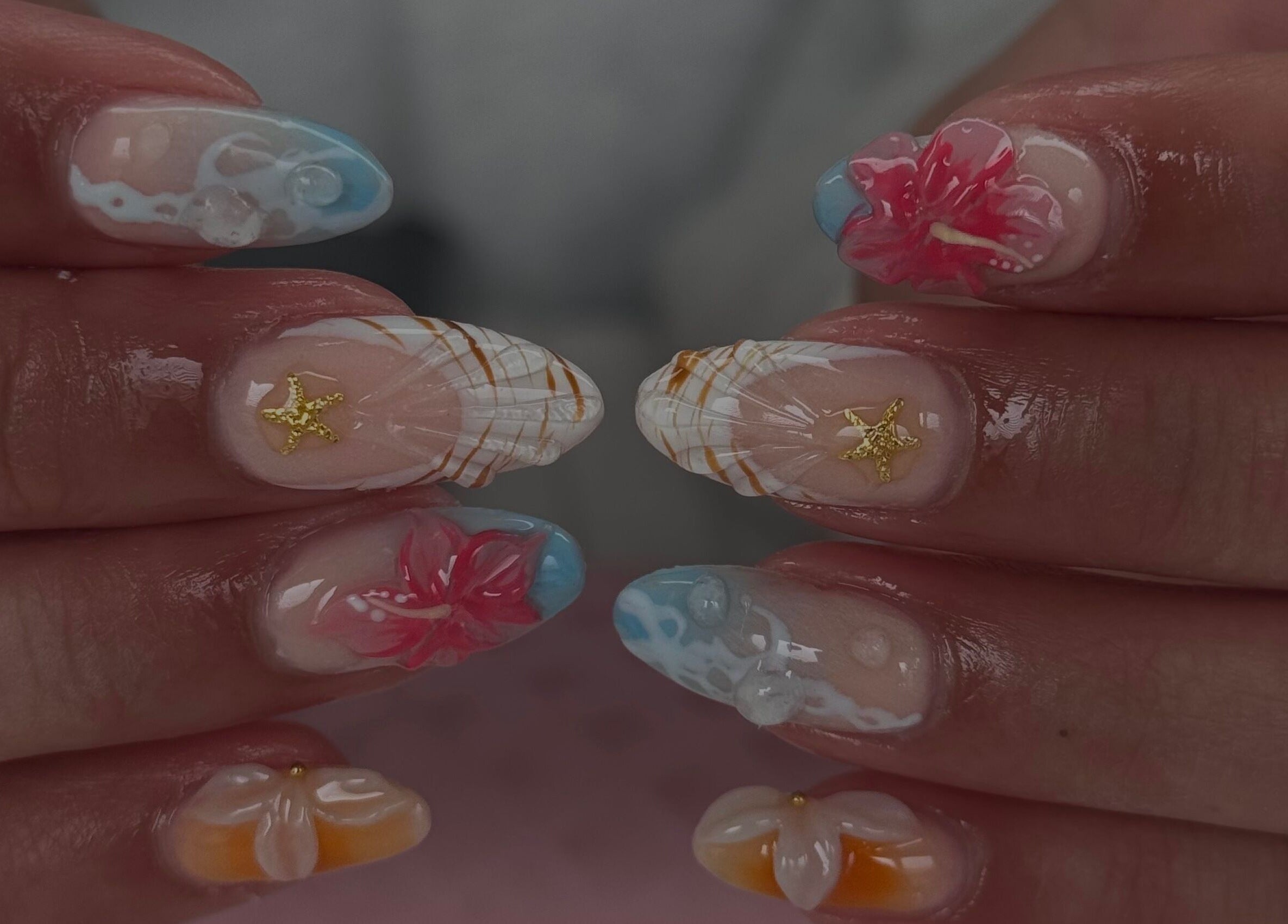 Intricate floral nail art with starfish details at Manis & Minks, Montréal, Québec, CA.
