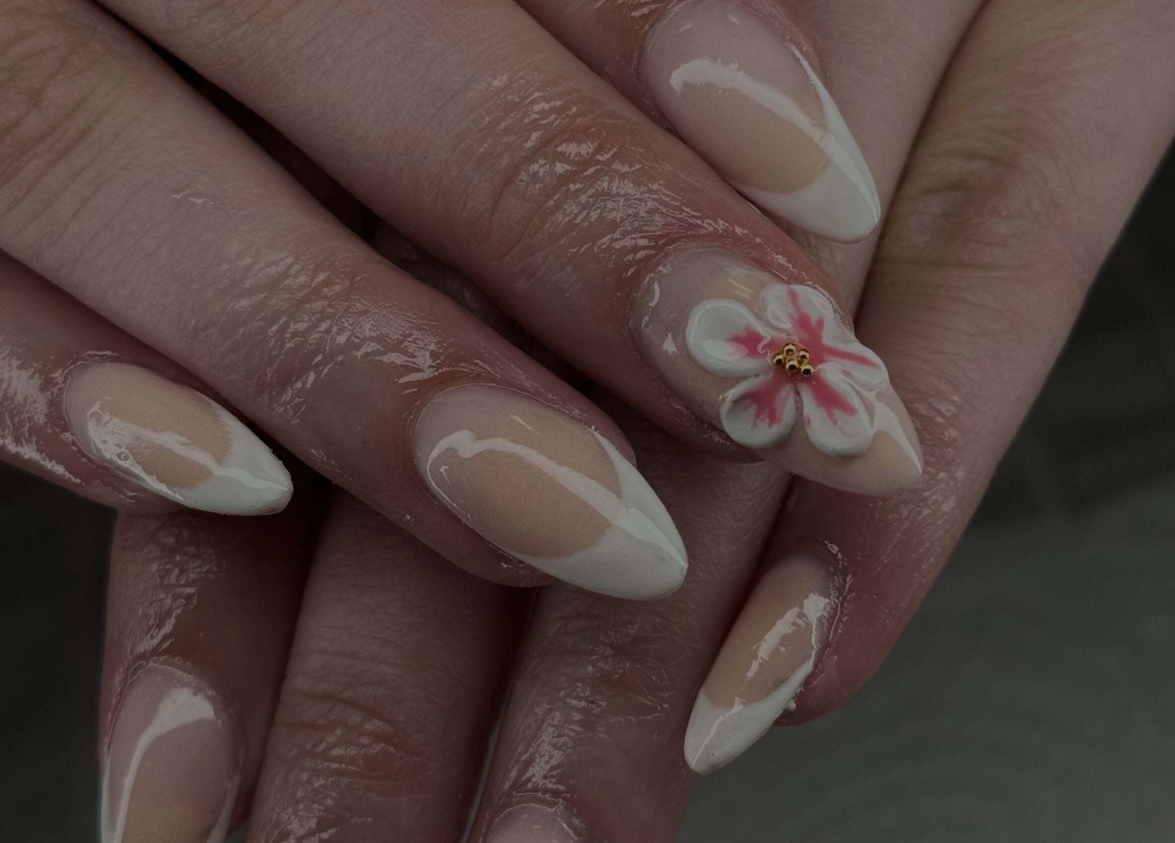 Elegant floral nail art by Manis & Minks in Montréal, Québec, CA showcases delicate design on manicured nails.