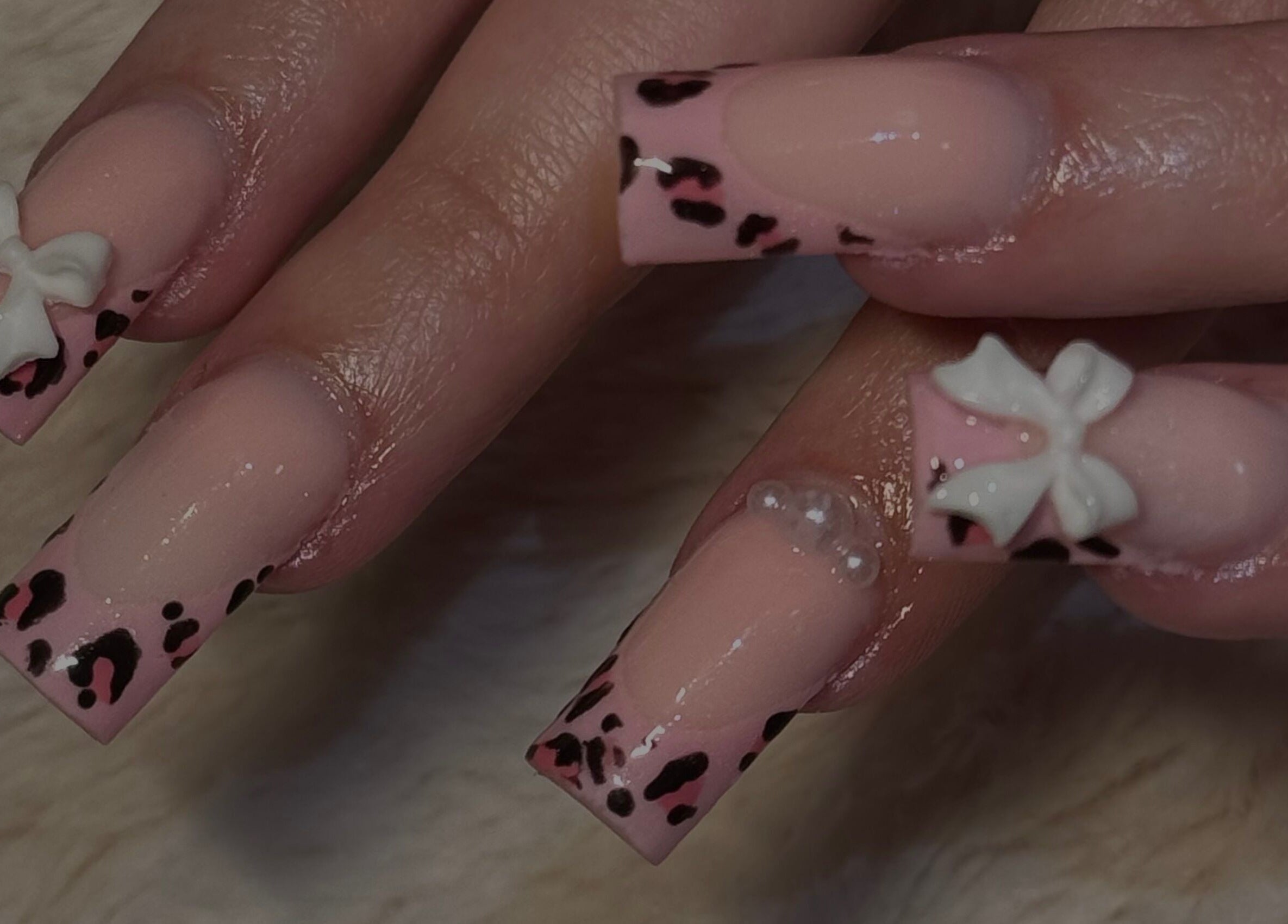 Chic leopard print and bow nail art from Manis & Minks, Montréal, Québec, CA.