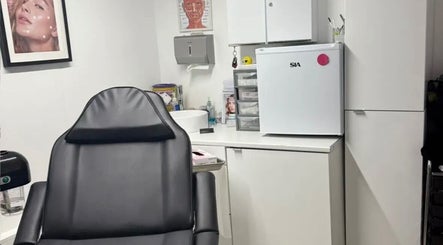 Modern and cozy treatment room at ML Aesthetics in Accrington, England, GB showcasing a comfortable chair.