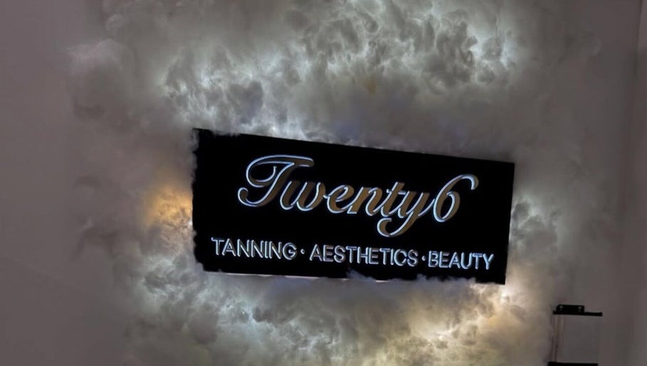 Illuminated sign for Twenty6 Tanning Aesthetics Beauty at Winks by Giulia, Rainham, England, GB.