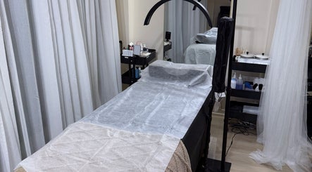 Luxurious treatment room at Rabesa Beauty Bar, Toronto, Ontario, CA, featuring a spa bed and elegant decor.