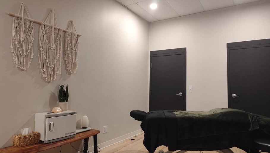 Calming therapy room at Advanced Massage Therapy, Winnipeg, Manitoba, CA with a massage table and soothing decor.