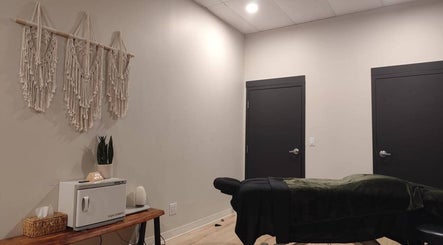 Calming therapy room at Advanced Massage Therapy, Winnipeg, Manitoba, CA with a massage table and soothing decor.