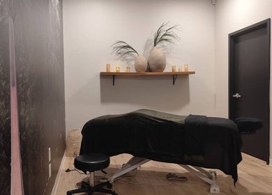 Cozy massage room at Advanced Massage Therapy in Winnipeg, Manitoba, CA, featuring a comfortable table and calming decor.