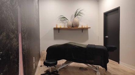 Cozy massage room at Advanced Massage Therapy in Winnipeg, Manitoba, CA, featuring a comfortable table and calming decor.