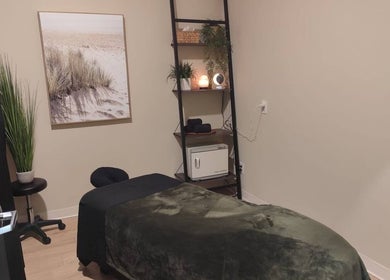 Massage room at Advanced Massage Therapy in Winnipeg, Manitoba, CA with cozy decor and massage bed.