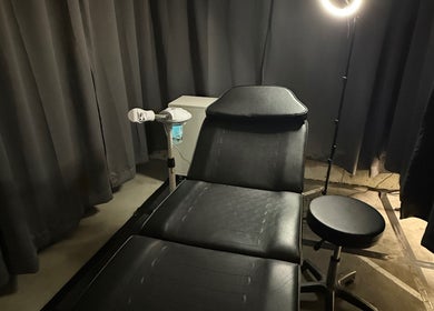 Treatment room at Style N Shine, Edmonton, Alberta, CA featuring a reclining chair and professional lighting.