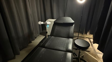 Treatment room at Style N Shine, Edmonton, Alberta, CA featuring a reclining chair and professional lighting.