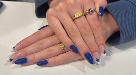 Blue and star nail design at Bmanicures, Cambridge, Ontario, CA. Perfect for stylish nail art seekers.