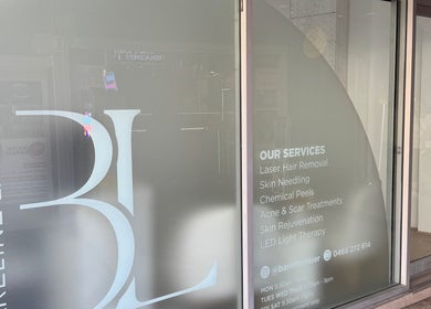 Front window displaying Bareline Laser services in Liverpool, New South Wales, AU.