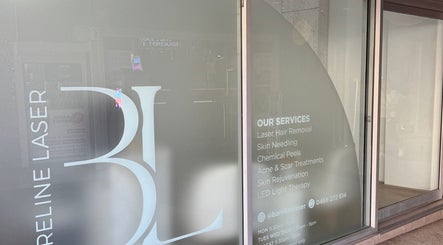 Front window displaying Bareline Laser services in Liverpool, New South Wales, AU.