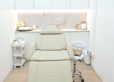Modern treatment room at Bareline Laser, Liverpool, New South Wales, AU with a sleek massage table and soft lighting.