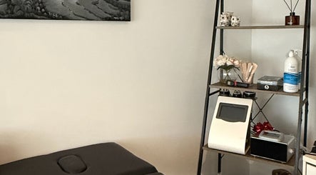 Bodiess By Bri massage room in Huntingdale, Western Australia, AU, featuring a shelf with spa essentials.