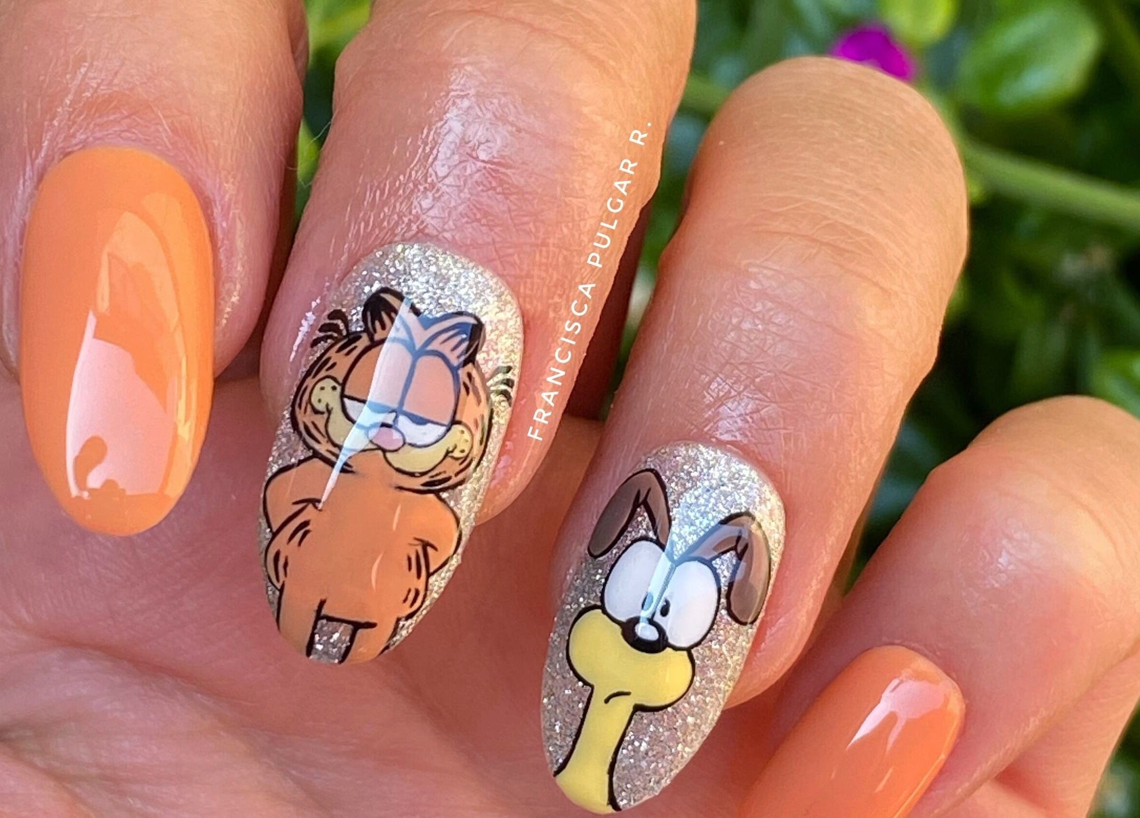 Diversas uñas decoradas con diseños de Garfield en MYKIN, Antofagasta, Antofagasta, CL.