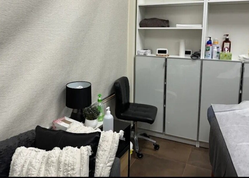 Cozy treatment room at Adelaide City Beauty, Kidman Park, South Australia, AU with comfortable seating and supplies.