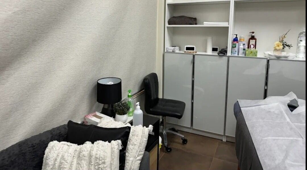 Cozy treatment room at Adelaide City Beauty, Kidman Park, South Australia, AU with comfortable seating and supplies.