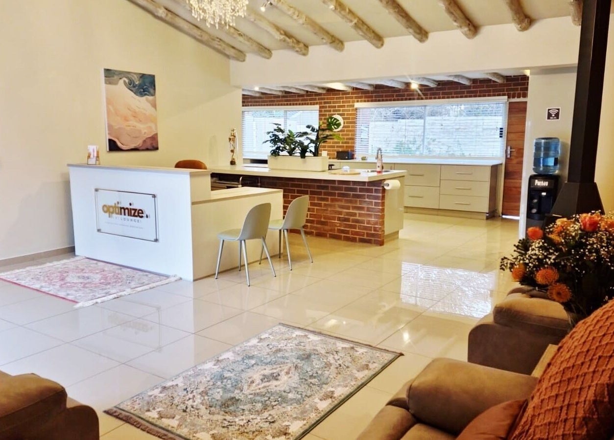 Relaxing interior at Optimize IV Lounge, Randburg, Gauteng, ZA with modern seating and warm decor.