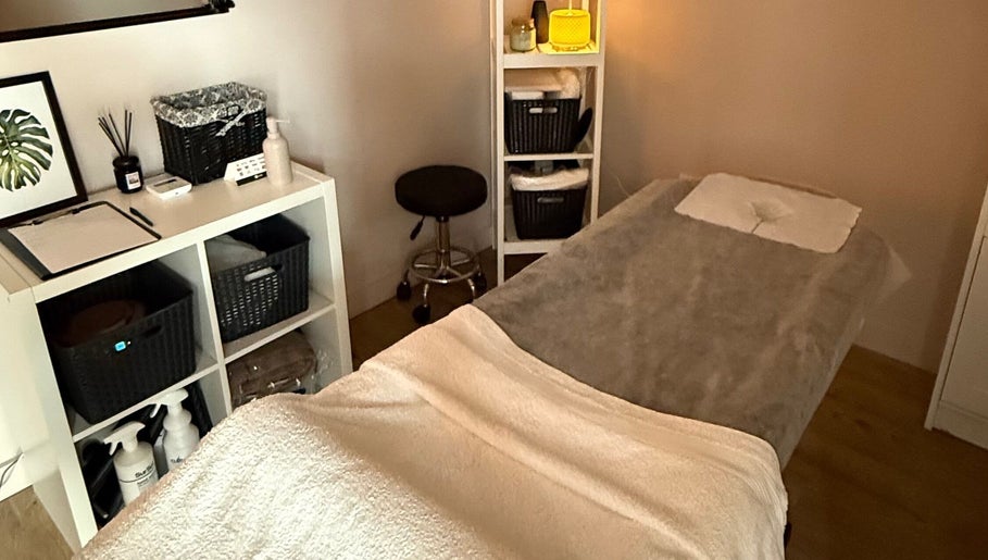Serene massage room at Velora Studio Massage & PMU, Portsmouth, England, GB, offering relaxation and wellness.