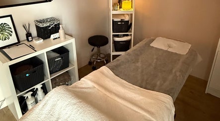 Relaxing massage room at Velora Studio Massage & PMU in Portsmouth, England, GB, features a cozy treatment bed.
