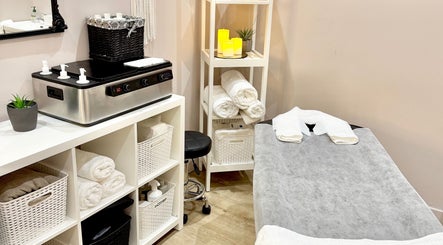Relaxing massage room at Velora Studio Massage in Portsmouth, England, GB, featuring a massage table and cozy decor.